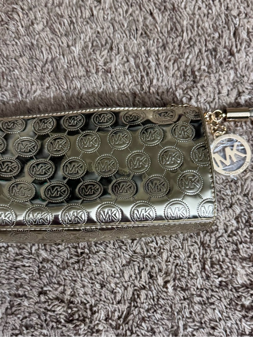Michael Kors Metallic Gold Embossed MK Logo Cosmetic bag